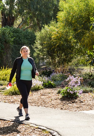 Young woman walking for fitness